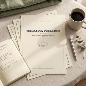May include: A stack of off-white paper worksheets titled Holidays, Family and Boundaries by Alberto Del Bove. The cover features a minimalist oval table graphic with one green dot, black text, and a thin green border. A silver pen rests nearby.