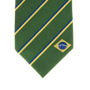 May include: A green tie with yellow and blue stripes and a small Brazilian flag embroidered on the bottom right corner.