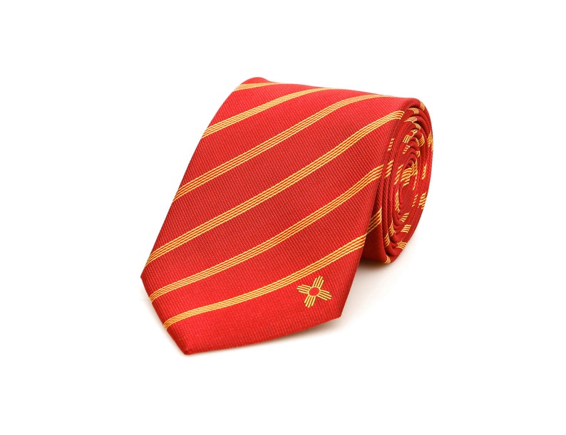 May include: A red and gold striped tie with a small gold star design.