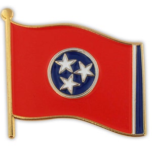 May include: A gold-colored pin with a red, white, and blue Tennessee state flag design. The flag features a blue circle with three white stars in the center.