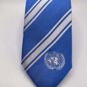 United Nations Skinny Tie - 2.5” - Inspired by the United Nations Flag - UN Thin Necktie - Diplomat - INCLUDES Personalized Embroidered Tag