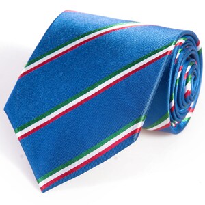 May include: A blue silk tie with white, red, and green stripes.