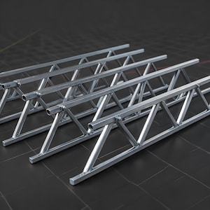 May include: A set of four parallel silver metal trusses, each featuring a long horizontal top and bottom bar connected by a series of diagonal support struts. The structures are constructed from square-profile tubing with welded joints.