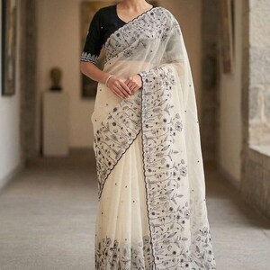 off-white floral threadwork organza saree with black embroidered blouse