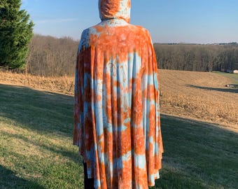 Soft bamboo and cotton ice-dyed cape with hood in blue and rust