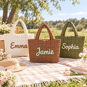 May include: Three quilted tote bags in white, brown, and olive green. The white bag features the name Emma in brown, the brown bag features the name Jamie in light green, and the olive green bag features the name Sophia in white script.