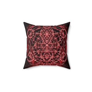 May include: A square throw pillow featuring a complex, symmetrical geometric pattern in shades of deep red and black. The design consists of interconnected circles, lines, and star-like shapes that create a dense, intricate, and layered visual effect.