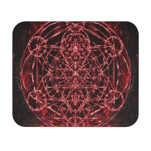 May include: A rectangular mouse pad featuring a complex, glowing red geometric pattern set against a dark, textured background. The design consists of overlapping circles, lines, and triangles, creating a symmetrical, intricate, and layered structure.