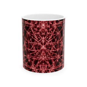 May include: A cylindrical ceramic mug featuring a white interior and a black exterior surface adorned with a complex, repeating geometric pattern in shades of deep red. The intricate design consists of overlapping circles and lines.