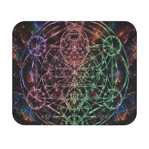May include: A rectangular mouse pad featuring a vibrant, multi-coloured geometric pattern of intersecting circles and lines. The design displays a gradient of pink, purple, and green hues set against a dark, textured background with cosmic nebula-like details.
