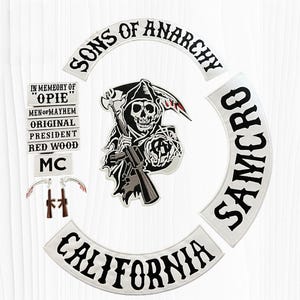 May include: A set of embroidered patches featuring a central grim reaper holding a rifle and scythe, with curved text patches reading SONS OF ANARCHY, SAMCRO, and CALIFORNIA. Includes smaller rectangular patches with text IN MEMEORY OF OPIE.