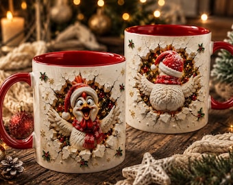 May include: Two white ceramic mugs with red interiors and handles, featuring a 3D-effect design of a chicken wearing a red Santa hat and scarf, appearing to burst through a cracked wall surface decorated with small colorful ornaments and snowflakes.