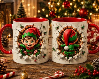 May include: Two white ceramic mugs with red interiors and handles, featuring a 3D-effect illustration of a Christmas elf. The left mug shows the elf facing forward, while the right mug shows the elf from behind, both appearing to break through a wall.