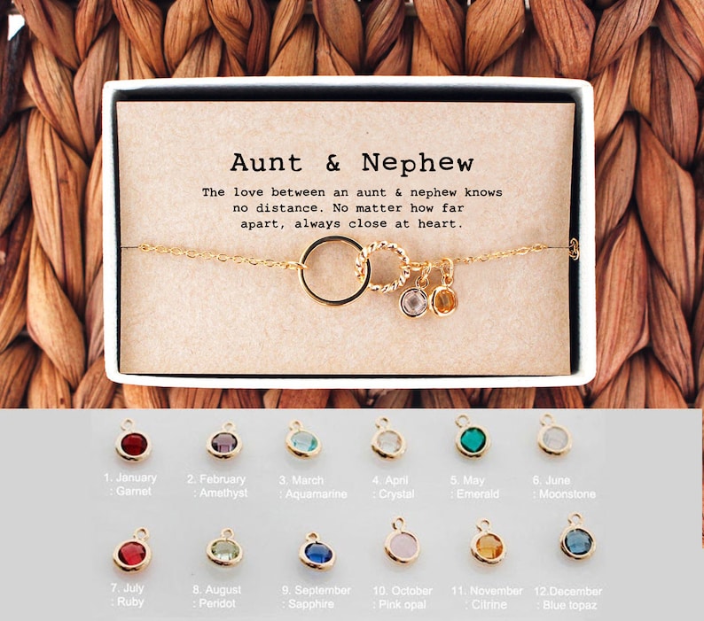Gold chain bracelet with interlocking circle pendant, wrapped in a gift box with message card. Customers can personalize it by adding birthstones of their choice for a loved one. The most common comments about this bracelet are dainty and cute!