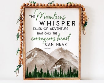 May include: A framed print with a watercolor illustration of mountains and a forest. The text reads "THE Mountains WHISPER TALES OF ADVENTURE THAT ONLY THE courageous heart CAN HEAR".