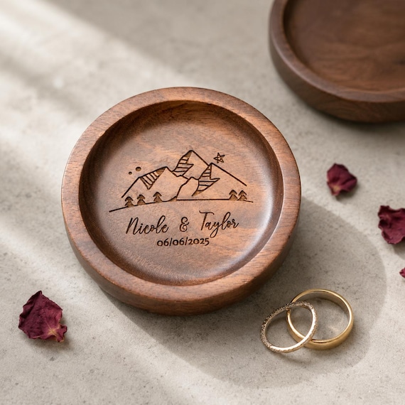A laser-engraved walnut ring dish personalized with names, initials, or a date — small, warm, and the kind of keepsake that actually gets kept.