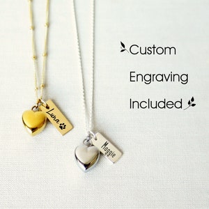 May include: Two silver chains with heart-shaped pendants and engraved tags. The gold chain has a tag that reads "Luna" and the silver chain has a tag that reads "Maggie". Custom engraving is included.