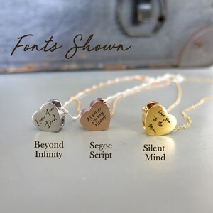 May include: Three silver, rose gold, and gold heart necklaces with different fonts and engravings. The silver necklace says "Love You Dad", the rose gold necklace says "Always in my Heart", and the gold necklace says "Love you to the Moon".