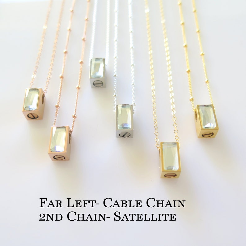 Six rectangular stainless steel urn pendants hang from gold, rose gold or silver chains in either cable or satellite.  The bottom of the cubed pendant has a screw that comes out to add ash to pendant and then placed back inside with a drop of glue.