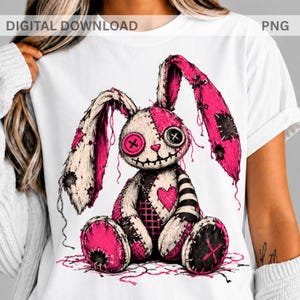 May include: A white t-shirt featuring a graphic of a stitched plush rabbit with pink and black patches, a heart on its chest, and button eyes. The design includes frayed edges, loose threads, and a stitched mouth, presented as a digital download.
