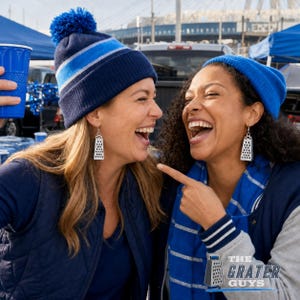 May include: A pair of silver-toned cheese grater earrings featuring a rectangular shape with a perforated surface pattern. The earrings are worn by two individuals who are also wearing blue knit hats and blue clothing in an outdoor setting.