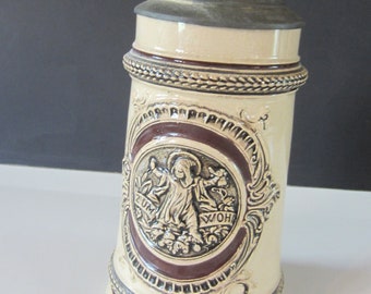 Vintage GERMAN STONEWARE Decorative Beer Stein* 1950's* Decorative Metal Lid** .5 L** Beautiful Embossed Design** Great Condition