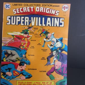 May include: A vintage comic book cover titled "Secret Origins Super Villains." The cover features illustrations of DC Comics superheroes and villains, including Superman, Batman, and The Joker, set against an orange background.