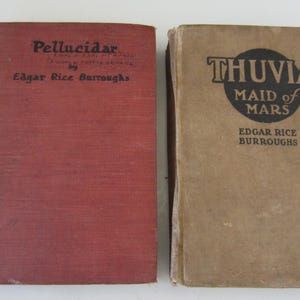 2 Vintage BURROUGHS BOOKS** Early 1900&#39;s** Vintage Books by Edgard Rice Burroughs** Grosset & Dunlap Pub.** Poor Condition** Buying  2 books