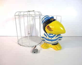 VINTAGE JAIL BIRD Composition Material Coin Bank *Crow in a Metal Cage** Painted** 1980's ** Has Original Stopper** Great Condition