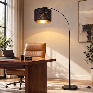 May include: A black arched floor lamp with a cylindrical shade featuring a star-like cutout pattern and a gold-toned interior. The lamp has a slender black metal pole and a circular base, emitting a warm glow from the light source.