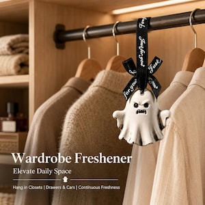 May include: A white ghost-shaped hanging ornament with a distressed finish, featuring a black ribbon tied in a bow with the text "for you" printed in white. The ghost has a sculpted face with an angry expression and is suspended from a rod.