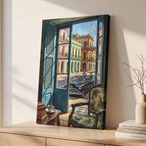 May include: A canvas print depicting an open blue window frame looking out onto a sunlit street with a vintage black convertible car, colorful colonial buildings, and a wooden chair in the foreground upholstered with a green parrot pattern.