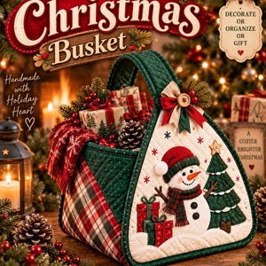 May include: A quilted Christmas basket featuring a snowman, a green Christmas tree, and gift boxes on the front. The basket has a green handle, red and green plaid side panels, and is decorated with a bow and a wooden button at the top.