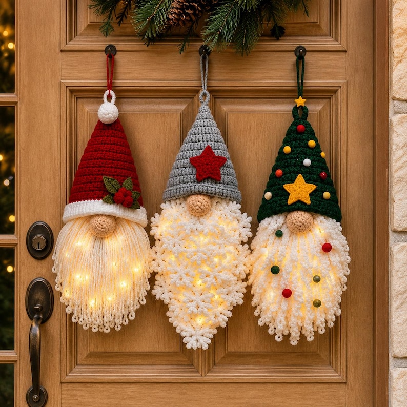 "Crochet gnome ornament bundle with fairy lights glowing in all three beards - Santa, gray, and green tree hat gnomes on wooden door