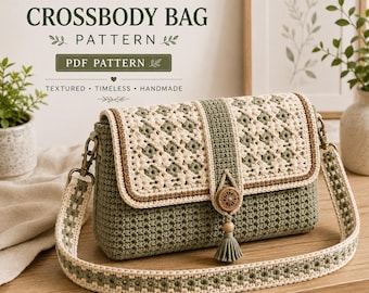 May include: A crochet crossbody bag featuring a sage green and cream floral pattern, a rectangular flap with a central vertical stripe, a wooden button closure with a tassel, and a matching wide shoulder strap with a repeating star motif.