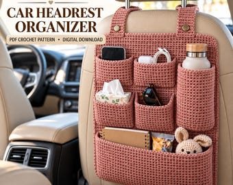 May include: A dusty rose crochet car headrest organizer featuring multiple pockets holding a smartphone, earbuds, a water bottle, tissues, sunglasses, a notebook, a snack, and a small stuffed animal. Text reads CROCHET CAR HEADREST ORGANIZER.