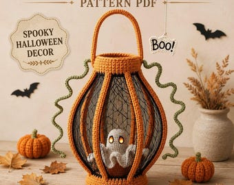 May include: A crochet ghost lantern pattern PDF featuring a central orange lantern structure with black mesh panels and a small white ghost figure inside. The design includes green curly accents, orange crochet pumpkins, and text reading CROCHET GHOST LANTERN PATTERN PDF, SPOOKY HALLOWEEN DECOR, Boo!, and INSTANT DIGITAL DOWNLOAD.