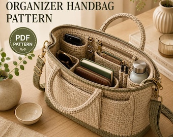 May include: A beige and olive green crochet organizer handbag featuring multiple interior compartments, two top handles, and a detachable shoulder strap. The bag is open, revealing internal pockets holding a phone, wallet, and pens. Text reads: CROCHET EVERYDAY ORGANIZER HANDBAG PATTERN PDF PATTERN.
