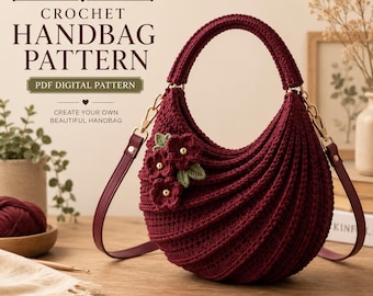 May include: A deep burgundy crochet handbag featuring a crescent shape, ribbed texture, and three small crocheted flowers with gold centers. The bag includes a matching burgundy strap attached with gold hardware. Text reads: CROCHET HANDBAG PATTERN.