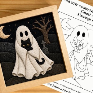 May include: A framed Kinusaiga fabric art piece featuring a ghost holding a black cat in a graveyard scene with a crescent moon and a bare tree. Beside it is a printed pattern sheet titled GHOSTLY COMPANIONS COLLECTION Ghost & Cat.