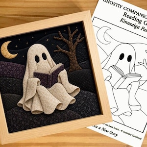 May include: A framed fabric art piece depicting a ghost reading a book under a crescent moon and a bare tree, accompanied by a printed paper pattern titled Ghostly Companions Collection Reading Ghost Kinusaiga Pattern with line art.