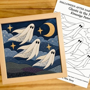 May include: A square framed Kinusaiga fabric art piece featuring three white ghosts floating against a dark blue night sky with a yellow crescent moon and stars, accompanied by a printed paper pattern titled Ghosts in the Night.