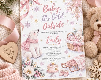 Könnte beinhalten: Eine rechteckige Einladungskarte für eine Babyparty mit weißem Hintergrund und rosa sowie goldenen Akzenten. Der Text lautet: A sweet little love is on the way, Baby, It's Cold Outside, zu Ehren von Emily, Sonntag, 17. Januar 2027, 13:00-16:00 Uhr.