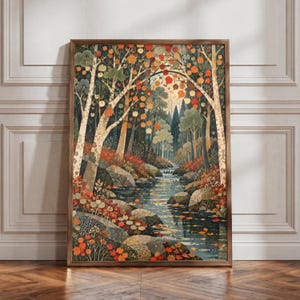 May include: A vertical rectangular wall art print featuring a forest landscape with a flowing stream. The scene includes birch trees with orange and red autumn leaves, grey rocks along the water, and a dense background of green and dark trees.