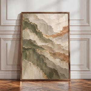 May include: A vertical rectangular framed wall art piece featuring an abstract landscape painting with thick, textured layers of paint in shades of olive green, cream, beige, and warm brown, accented with subtle metallic gold leaf detailing.