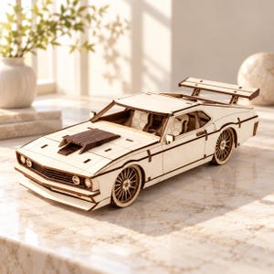May include: A light-colored wooden model car featuring a prominent rear spoiler, a dark brown hood scoop, and detailed multi-spoke wheels. The vehicle has a low-profile design with visible interior seating and a sleek, angular body construction.