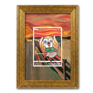 May include: A rectangular gold-toned ornate frame containing a trading card featuring a stylized owl character with large eyes and wings held to its face, set against a vibrant orange and red swirling sky background reminiscent of a famous painting.