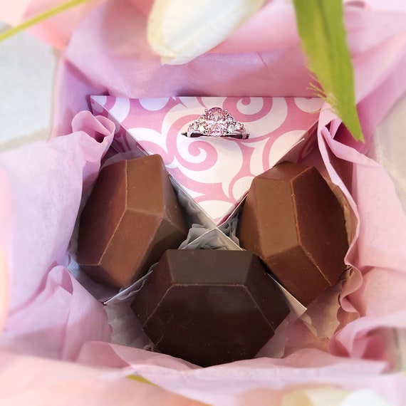 Premium Photo  Melting pink chocolate melts to make mini pink chocolates.