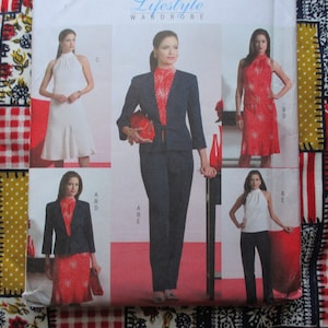 May include: A sewing pattern booklet featuring five different clothing designs for women. The designs include a white sleeveless dress, a red sleeveless dress, a navy blue blazer and pants, a red sleeveless dress with a navy blue blazer, and a white sleeveless top with black pants. The booklet cover features the text "Lifestyle Wardrobe".