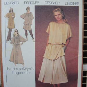 May include: A sewing pattern for a dress with a gathered skirt and a fitted bodice. The pattern is called "Harriet Selwyn's Fragments".